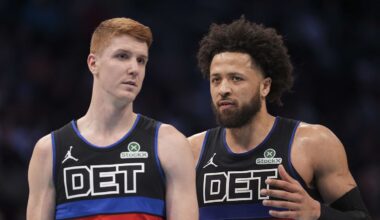 Feb 9, 2026; Charlotte, North Carolina, USA;Detroit Pistons guard Cade Cunningham (2) talks with guard Kevin Huerter (27) as he enters the game against the Charlotte Hornets during the second quarter at Spectrum Center. Mandatory Credit: Jim Dedmon-Imagn Images