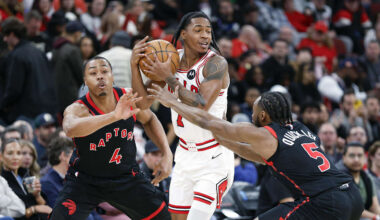 Feb 19, 2026; Chicago, Illinois, USA; Toronto Raptors forward Scottie Barnes (4) and guard Immanuel Quickley (5) defend against Chicago Bulls guard Rob Dillingham (7) during the first half at United Center. Mandatory Credit: Kamil Krzaczynski-Imagn Images
