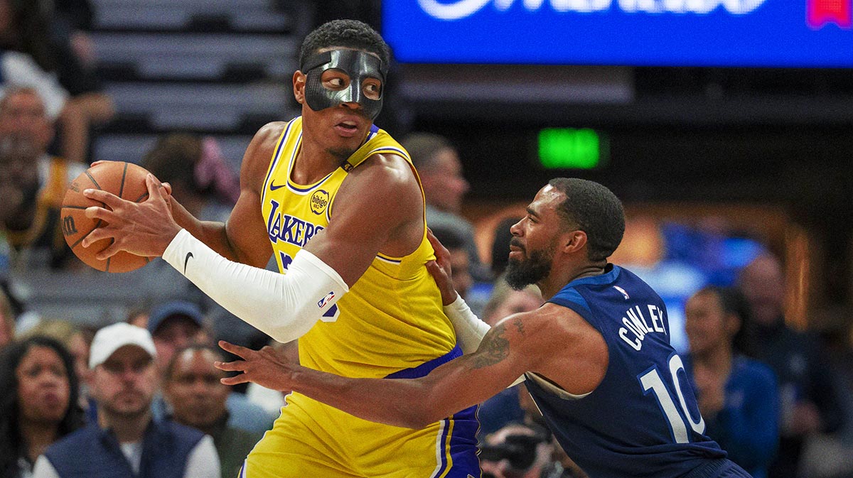 Los Angeles Lakers forward Rui Hachimura (28) backs towards the basket as Minnesota Timberwolves guard Mike Conley (10) plays defense in the first half during game three of first round for the 2024 NBA Playoffs at Target Center.