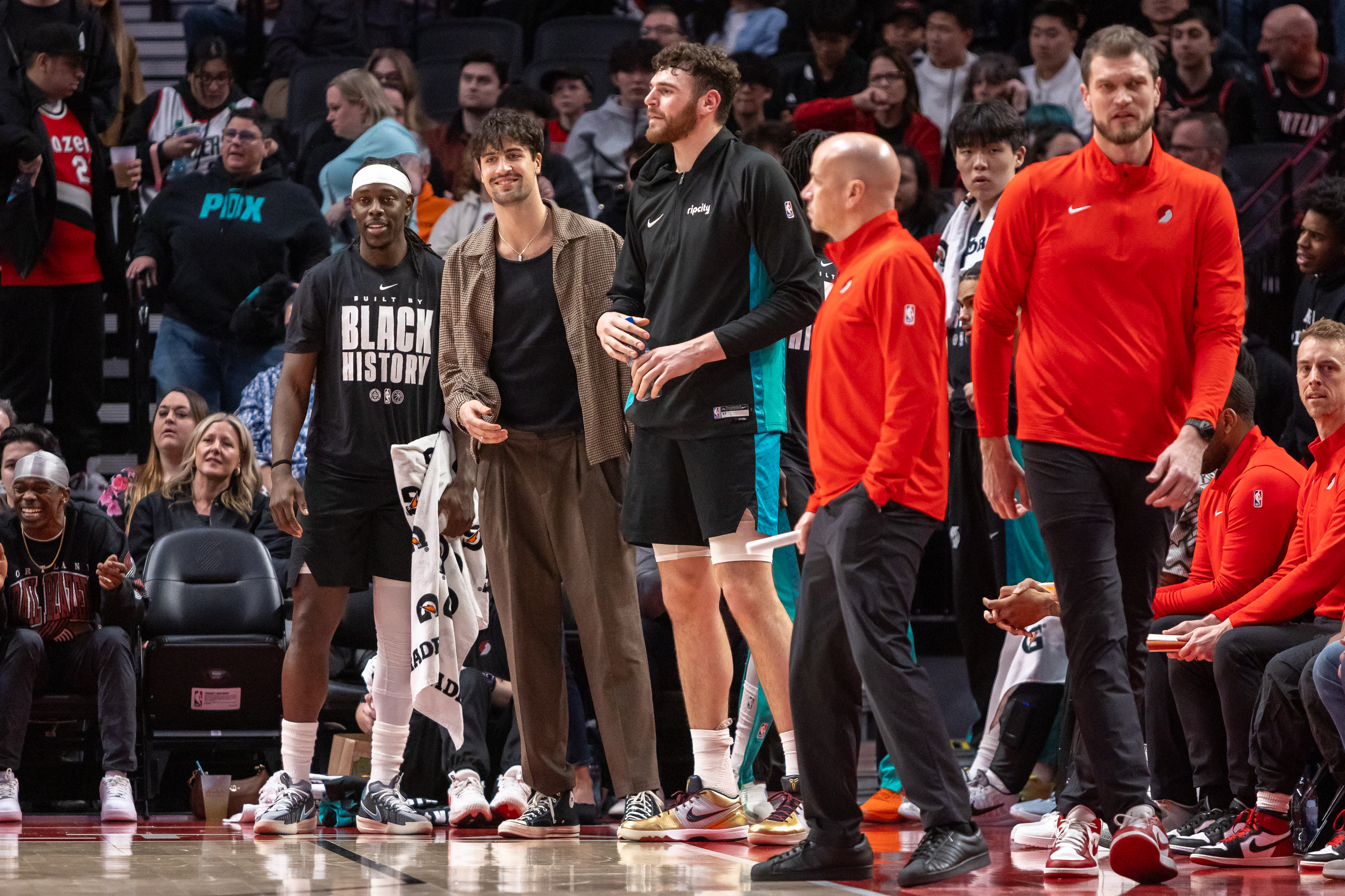 Jrue Holiday (left) and Deni Advija react after a three-pointer as the Portland Trail Blazers face the Phoenix Suns in an NBA game at Moda Center on Tuesday, Feb. 3, 2026.