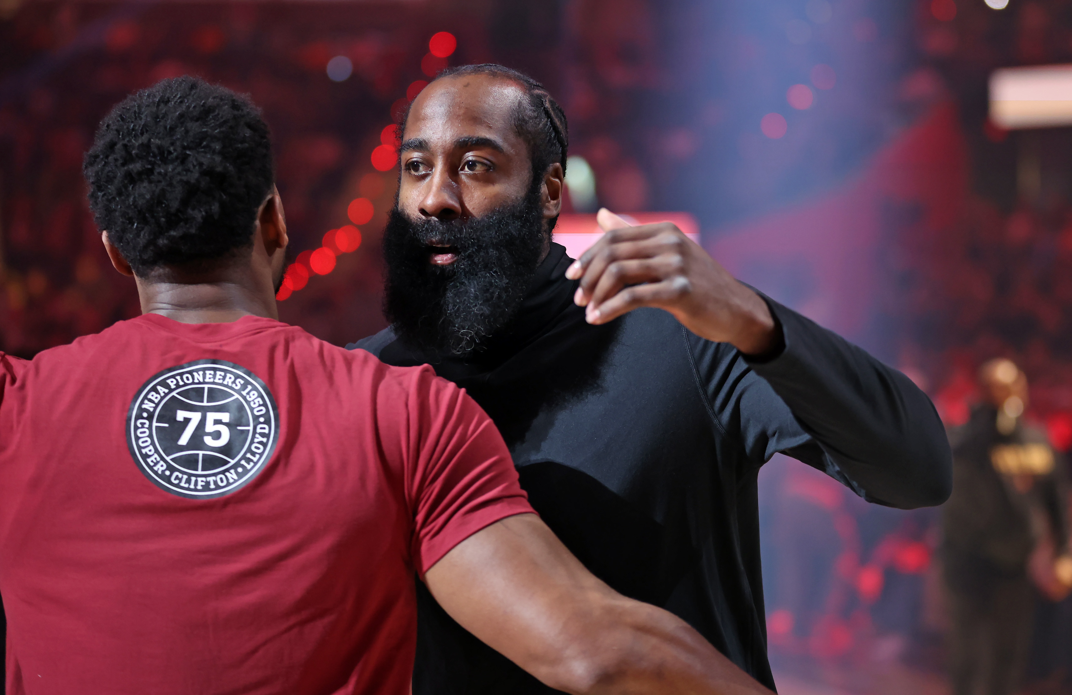Cleveland Cavaliers guard James Harden and Cleveland Cavaliers guard Donovan Mitchell hug during introductions before the game against the Washington Wizards. 