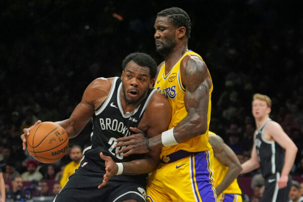Los Angeles Lakers' Deandre Ayton, right, defends Brooklyn Nets' Day'ron Sharpe during the second half of an NBA basketball game Tuesday, Feb. 3, 2026, in New York. (AP Photo/Frank Franklin II)