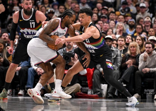 Spencer Jones (21) of the Denver Nuggets defends Kawhi Leonard (2) of the LA Clippers during the fourth quarter at Ball Arena in Denver on Friday, January 30, 2026. (Photo by AAron Ontiveroz/The Denver Post)