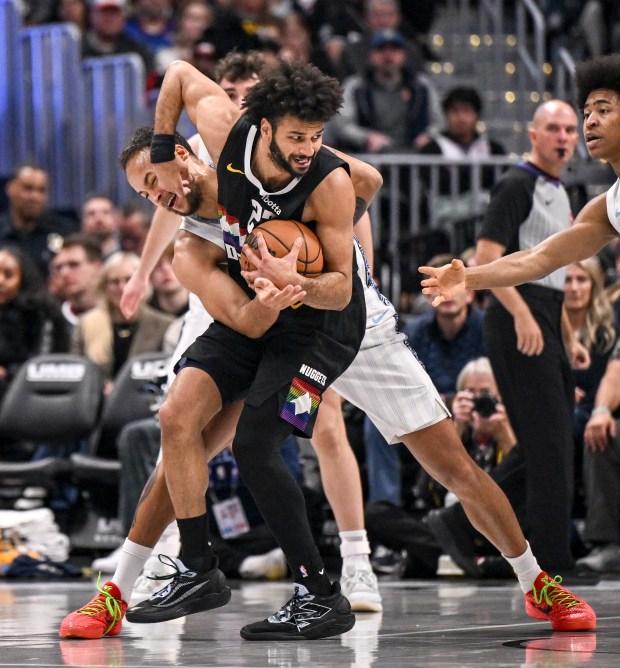 Kyle Anderson (5) of the Memphis Grizzlies defends Jamal Murray (27) of the Denver Nuggets during the third quarter at Ball Arena in Denver on Wednesday. (Photo by AAron Ontiveroz/The Denver Post)
