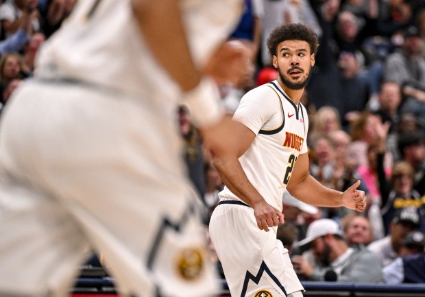 Cameron Johnson (23) of the Denver Nuggets reacts to making a three pointer against the Miami Heat during the second quarter at Ball Arena in Denver on Wednesday, Nov. 5, 2025. (Photo by AAron Ontiveroz/The Denver Post)