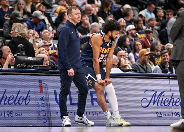 David Adelman of the Denver Nuggets speaks to Jamal Murray (27) during the third quarter against the New Orleans Pelicans at Ball Arena on Wednesday, Oct. 29, 2025. (Photo by AAron Ontiveroz/The Denver Post)