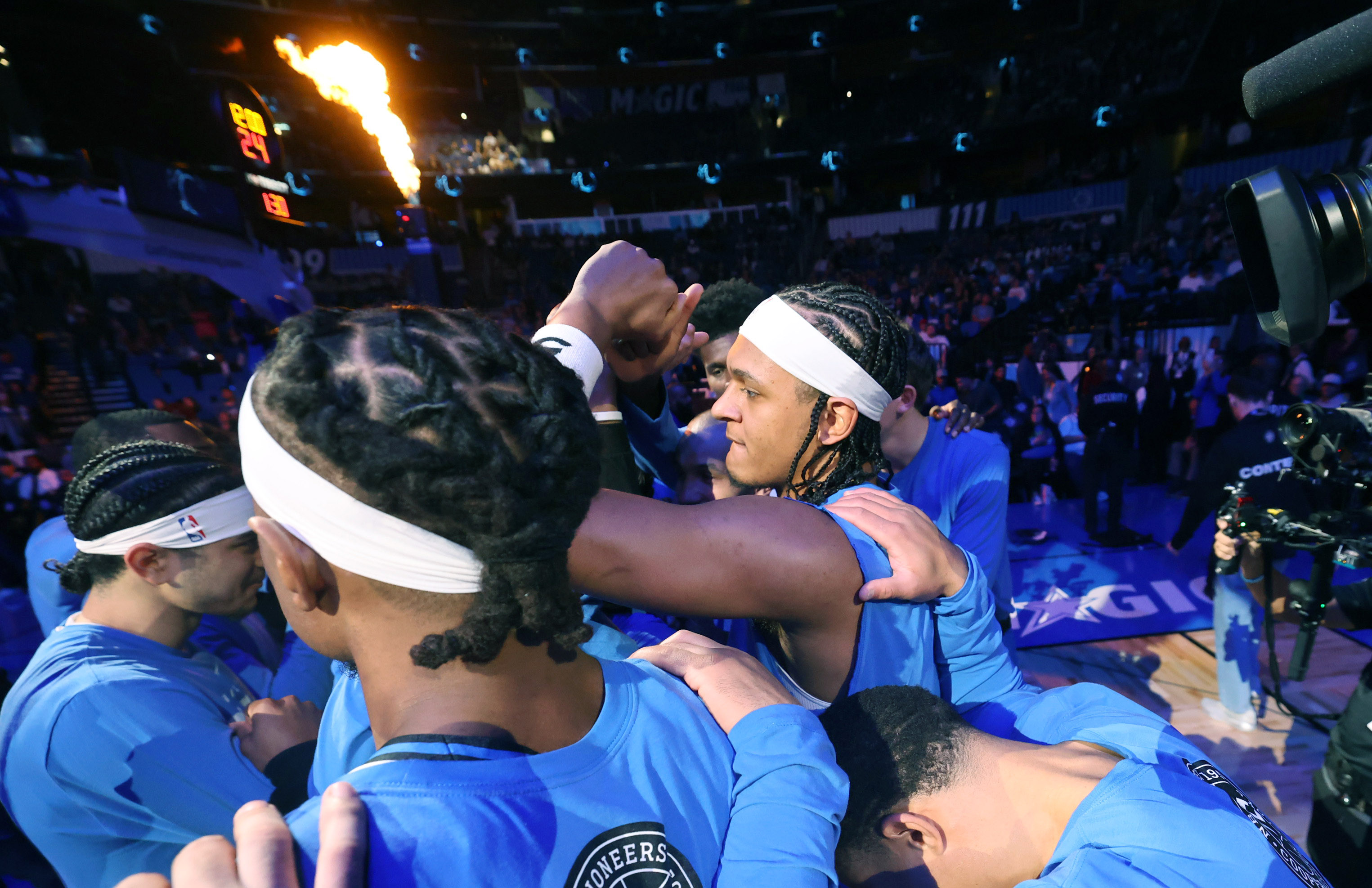 Orlando players gather around forward Paolo Banchero (middle) before the...