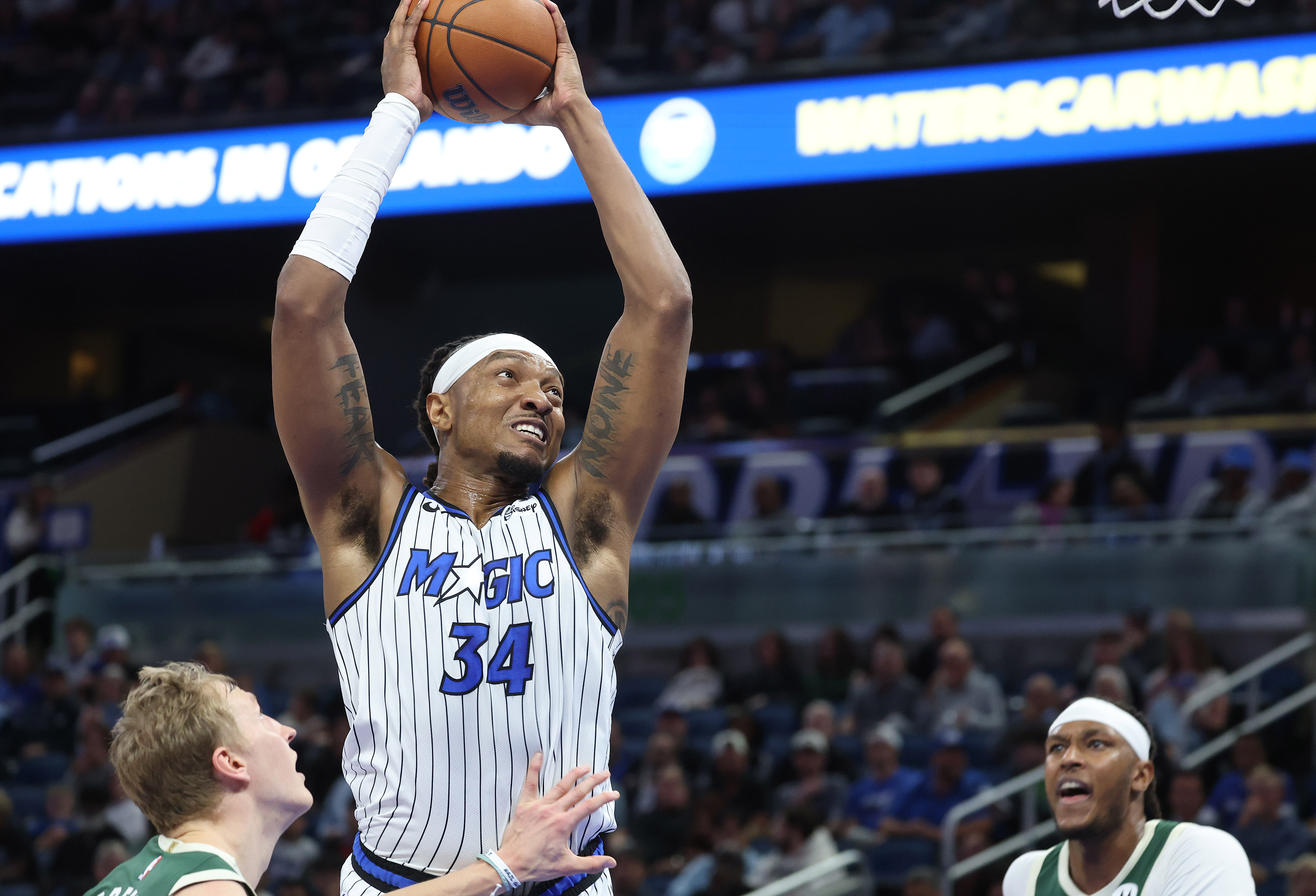 Orlando center Wendell Carter Jr. (34) leaps over Milwaukee forward...