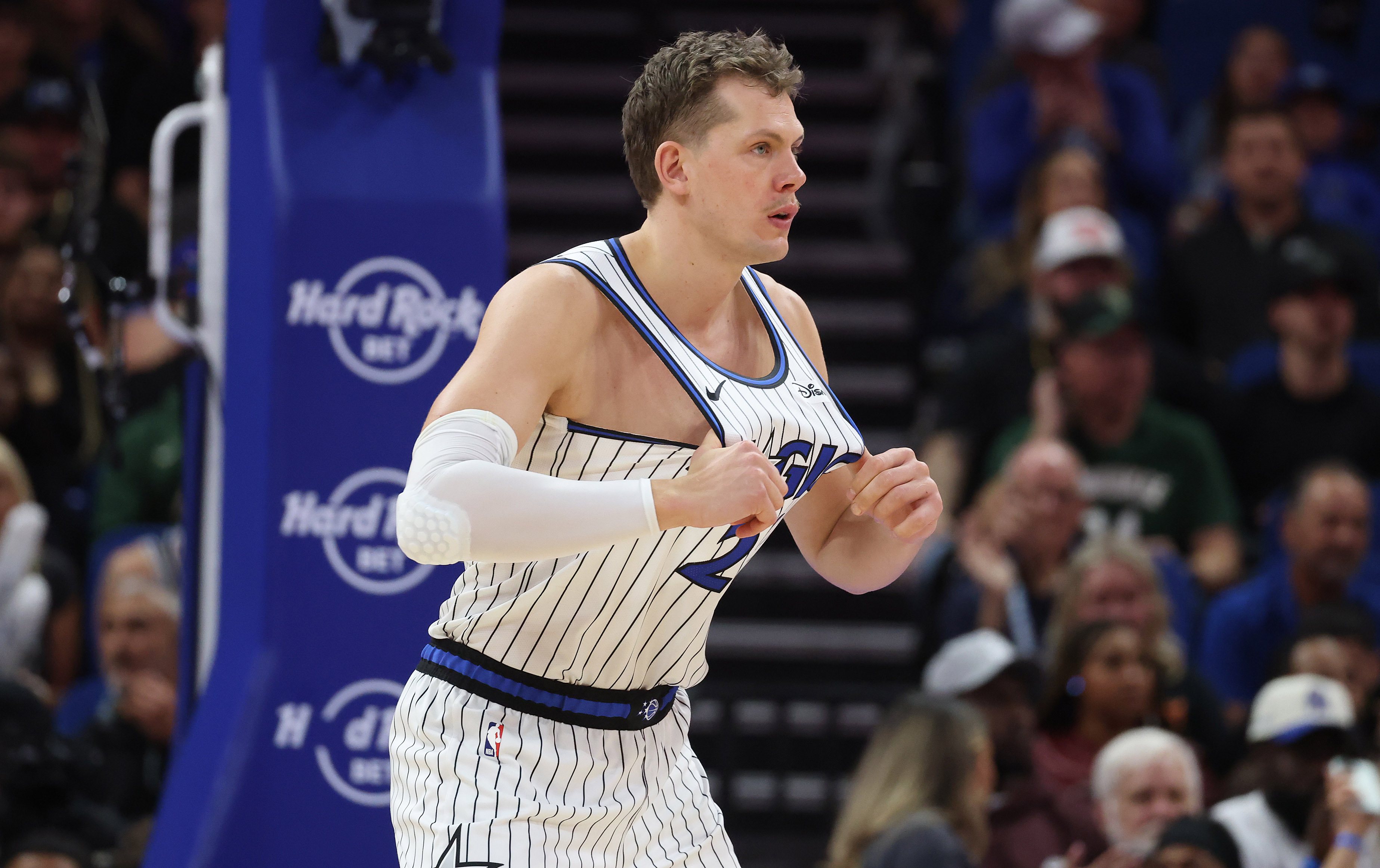 Orlando center Mo Wagner tugs on his jersey during the...