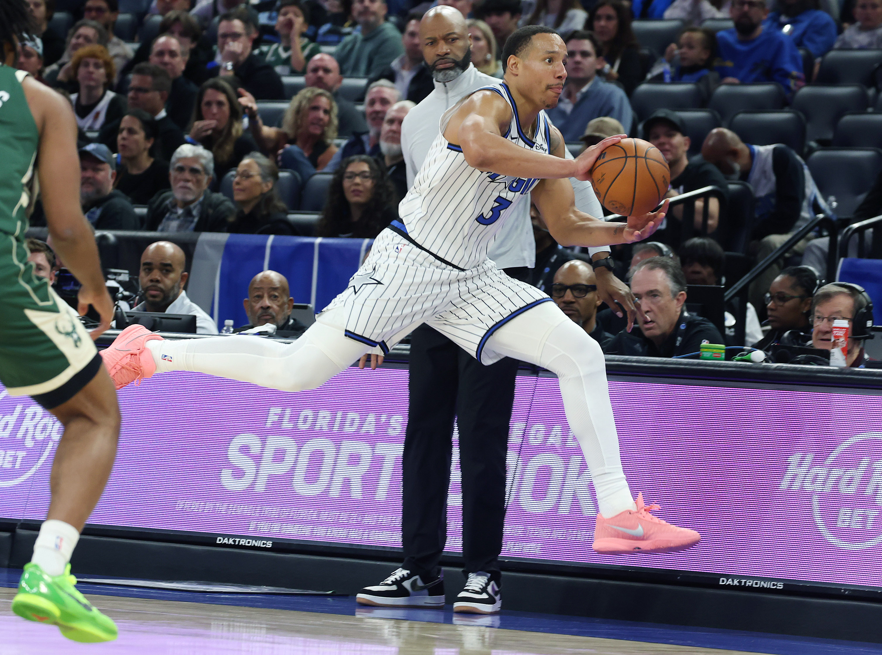 Orlando forward Desmond Bane (3) leaps in front of head...
