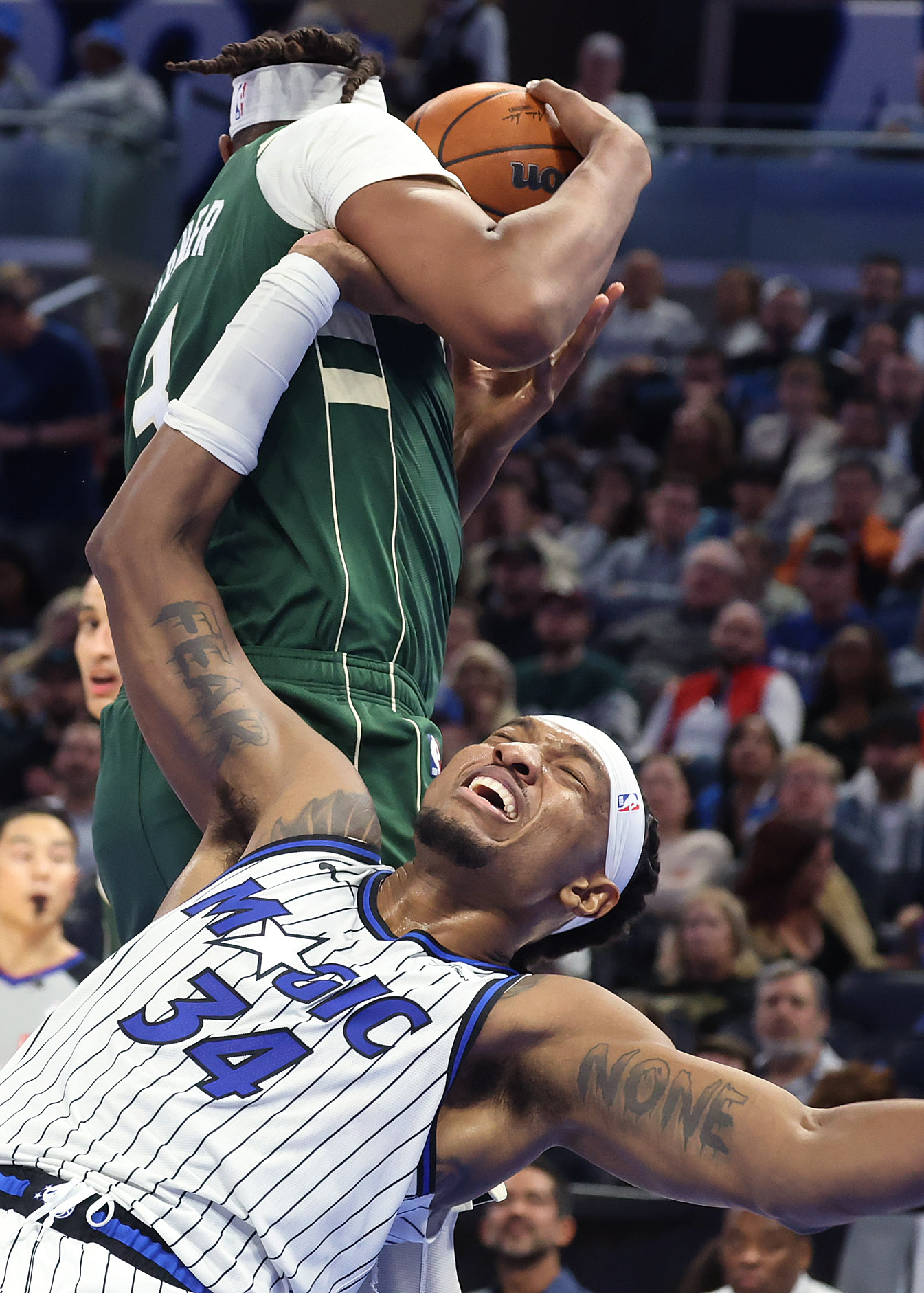 Orlando center Wendell Carter Jr. (34) is fouled by Milwaukee...