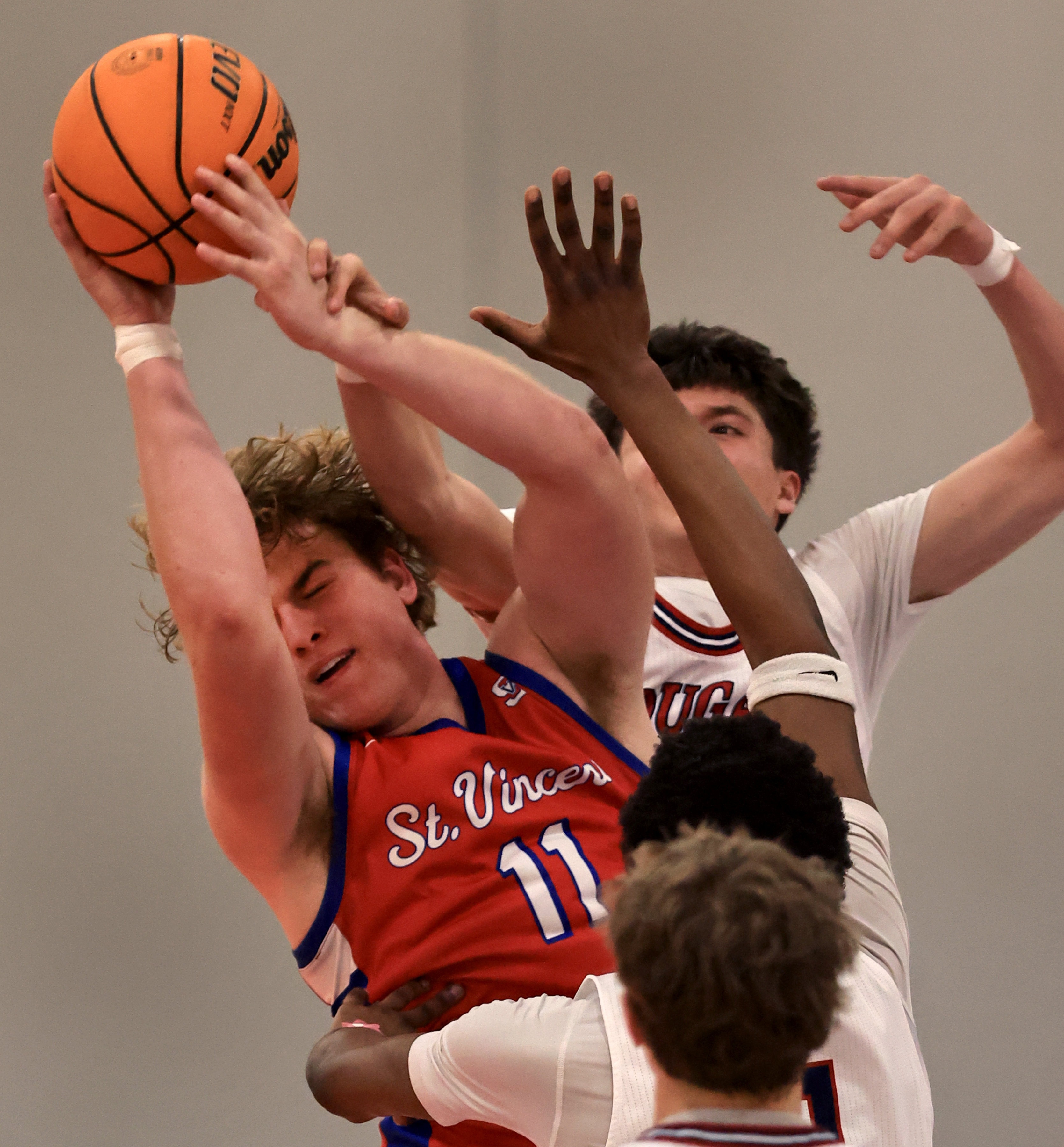 Jack Ellis of St. Vincent brings down a rebound over...