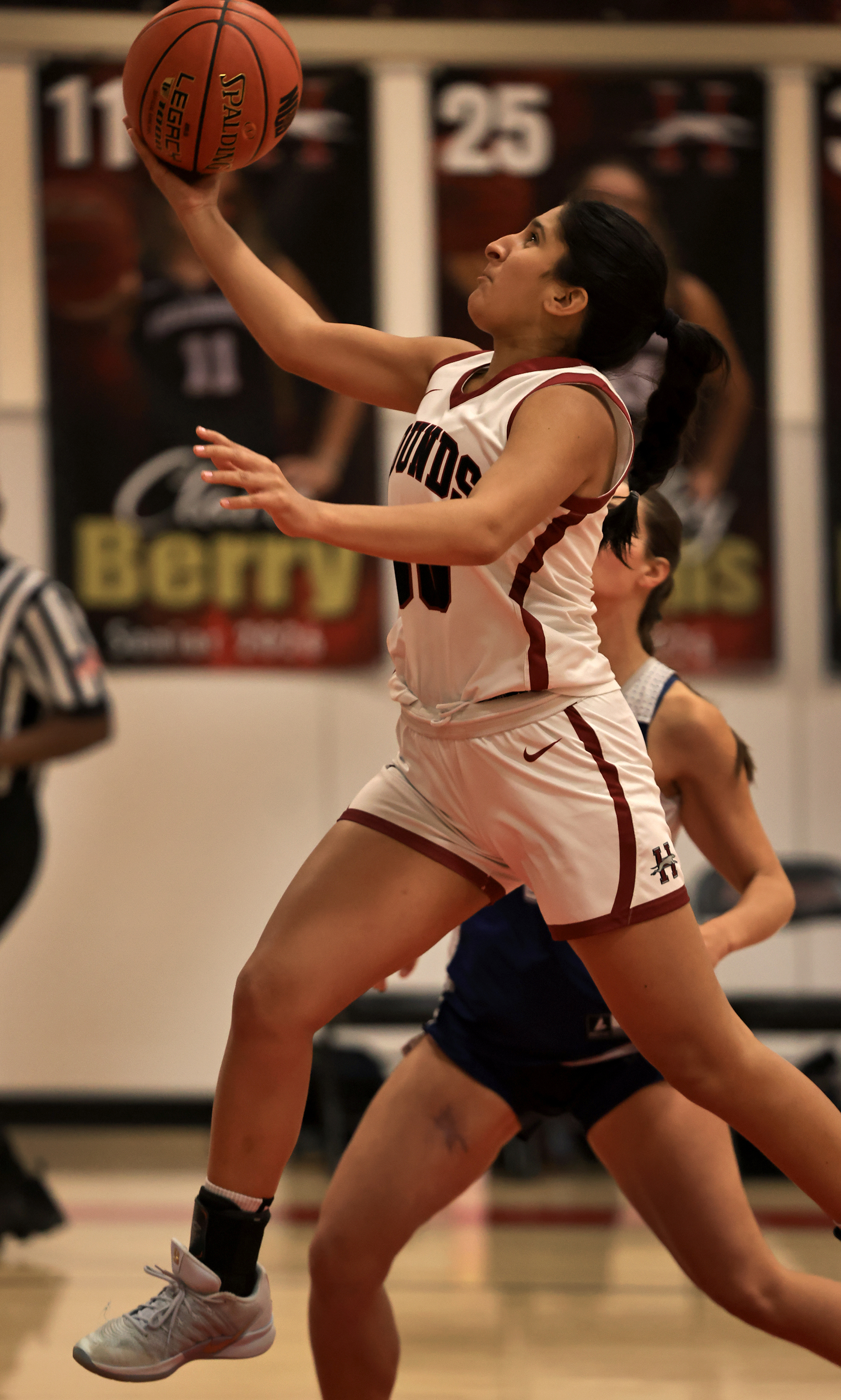 Maya Sherman of Healdsburg drives the lane against Credo, Friday,...