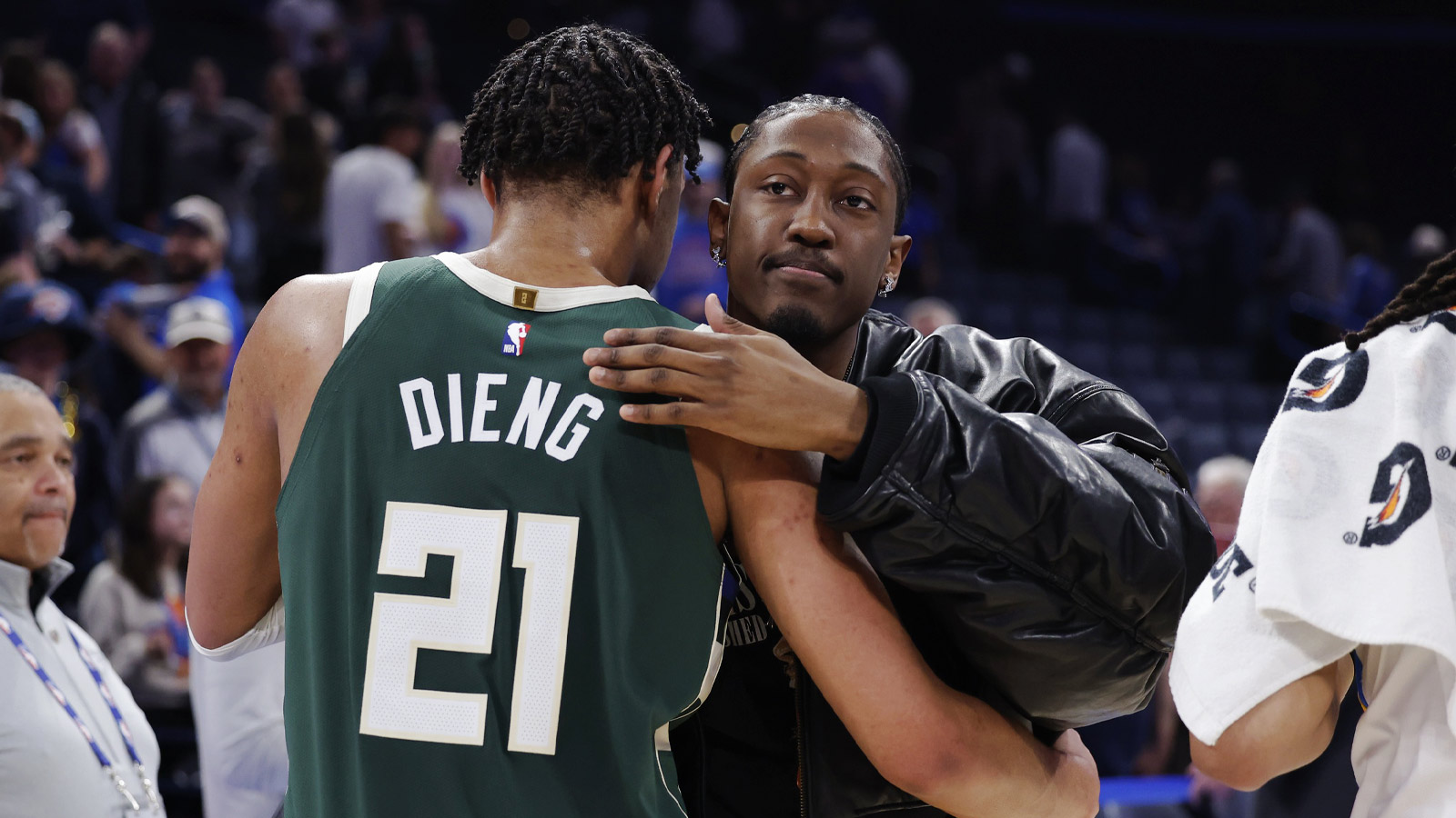 Thunder guard/forward Jalen Williams (8) hugs former teammate Milwaukee Bucks forward Ousmane Dieng (21) at the end of their game at Paycom Center