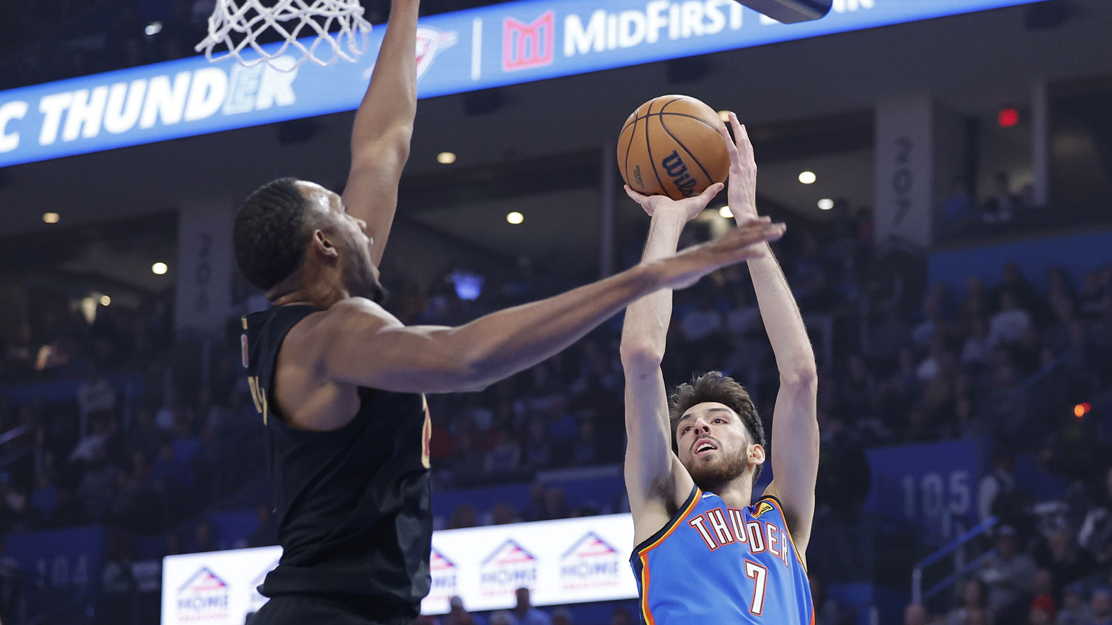 Thunder center/forward Chet Holmgren (7) shoots as Cleveland Cavaliers center Evan Mobley (4) defends during the first quarter at Paycom Center