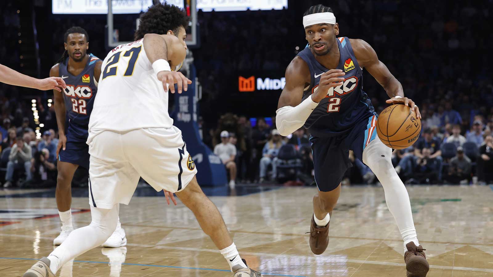 Thunder guard Shai Gilgeous-Alexander (2) drives around Denver Nuggets guard Jamal Murray (27) during the third quarter at Paycom Center
