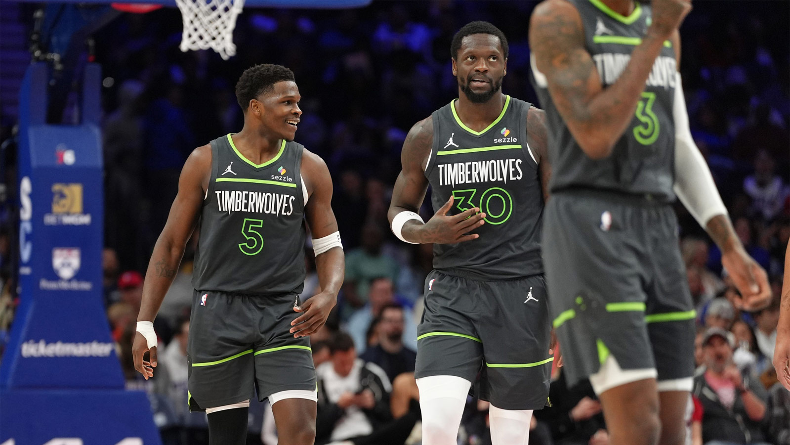 Timberwolves guard Anthony Edwards (5) celebrates with Minnesota Timberwolves forward Julius Randle (30) after making a shot against the Golden State Warriors in the first half during game five of the second round for the 2025 NBA Playoffs at Target Center