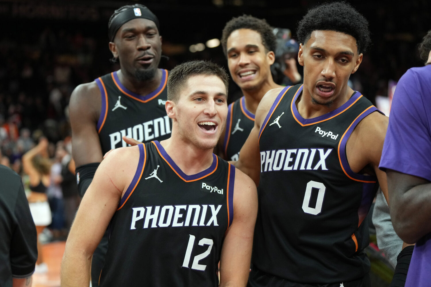 Phoenix Suns guard Collin Gillespie (12) celebrates with teammates after hitting the winning shot a...