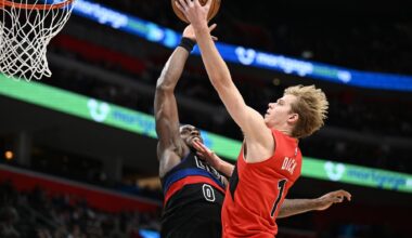 Jan 11, 2025; Detroit, Michigan, USA; Toronto Raptors guard Gradey Dick (1) has his shot blocked by Detroit Pistons center Jalen Duren (0) in the third quarter at Little Caesars Arena. Mandatory Credit: Lon Horwedel-Imagn Images