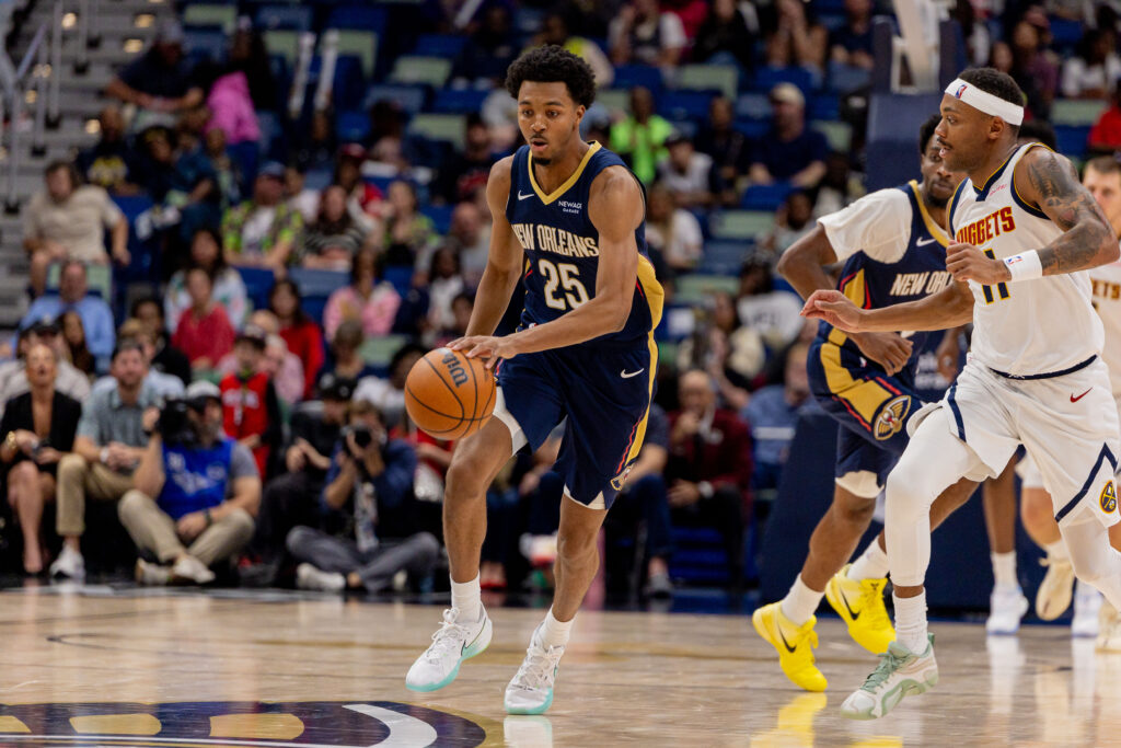 Nov 19, 2025; New Orleans, Louisiana, USA; New Orleans Pelicans forward Trey Murphy III (25) brings the ball up court against Denver Nuggets guard/forward Bruce Brown (11) during the second half at Smoothie King Center. Mandatory Credit: Stephen Lew-Imagn Images