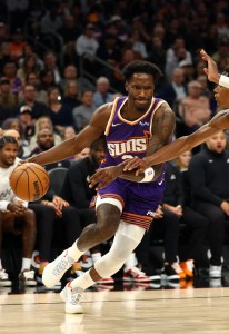 Nov 29, 2025; Phoenix, Arizona, USA; Phoenix Suns forward Nigel Hayes-Davis (21) against the Denver Nuggets in the first half at the Mortgage Matchup Center. Mandatory Credit: Mark J. Rebilas-Imagn Images