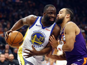 Dec 18, 2025; Phoenix, Arizona, USA; Golden State Warriors forward Draymond Green (23) against Phoenix Suns forward Dillon Brooks in the first half at Mortgage Matchup Center. Mandatory Credit: Mark J. Rebilas-Imagn Images
