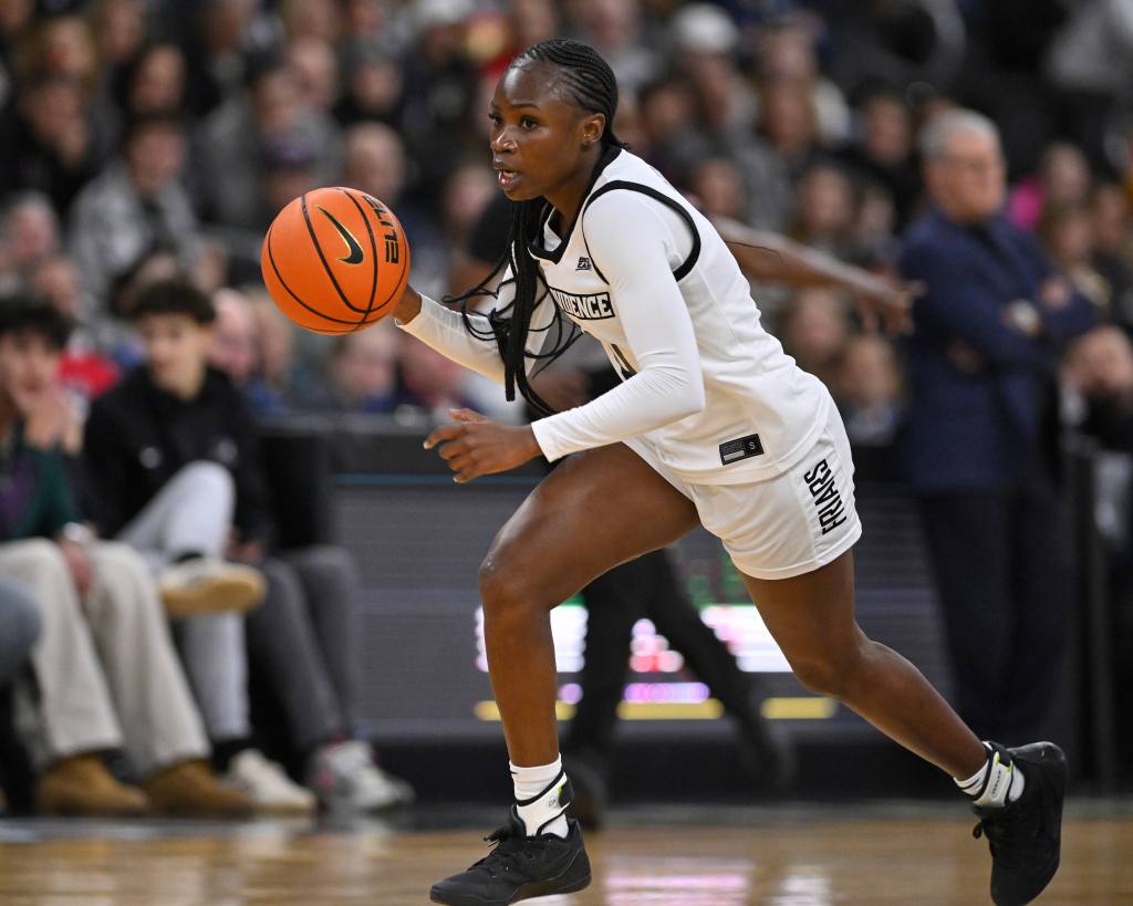 Guard Sabou Gueye dribbles the ball up the court with her right hand