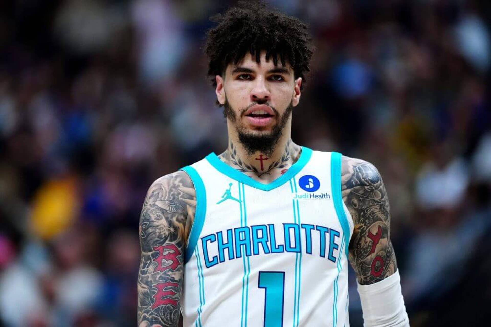 Charlotte Hornets point guard LaMelo Ball looks on during a game against the Denver Nuggets.
