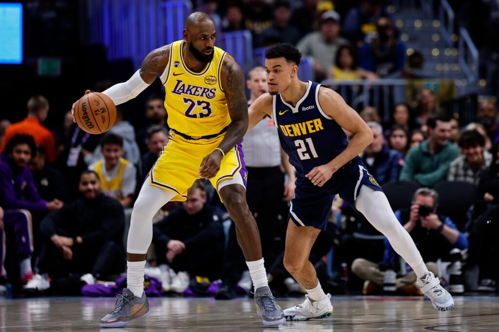 Jan 20, 2026; Denver, Colorado, USA; Los Angeles Lakers forward LeBron James (23) controls the ball as Denver Nuggets forward Spencer Jones (21) guards in the second quarter at Ball Arena. Mandatory Credit: Isaiah J. Downing-Imagn Images