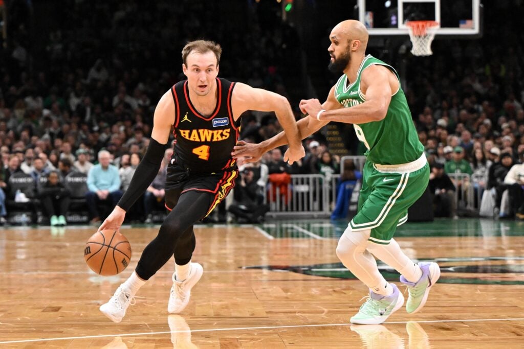  Atlanta Hawks guard Luke Kennard (4) drives to the basket against Boston Celtics guard Derrick White (9) during the first half at the TD Garden.