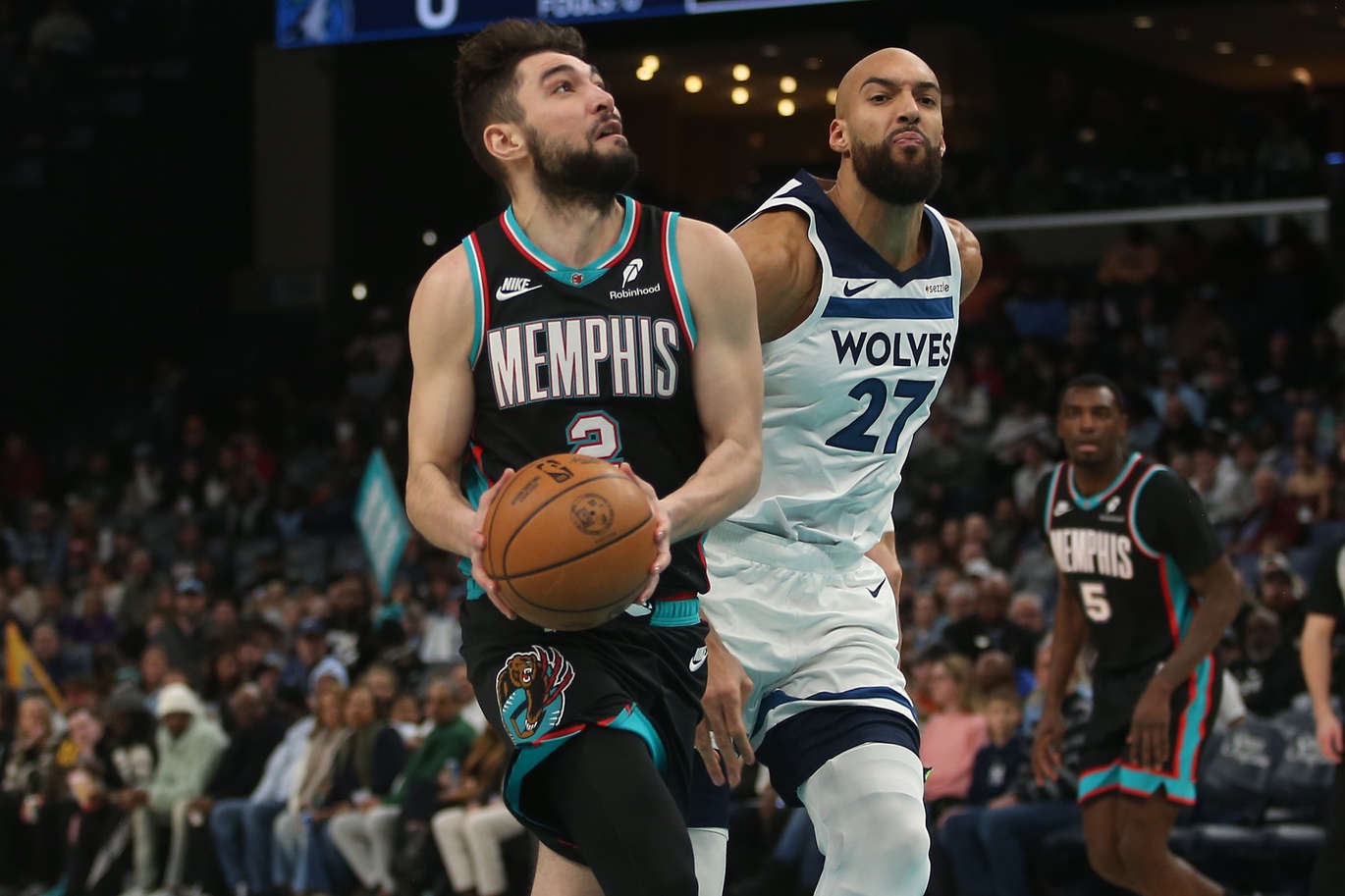 Jan 31, 2026; Memphis, Tennessee, USA; Memphis Grizzlies guard Ty Jerome (2) drives to the basket as Minnesota Timberwolves center Rudy Gobert (27) defends during the first quarter at FedExForum. Mandatory Credit: Petre Thomas-Imagn Images