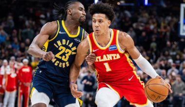 Jan 31, 2026; Indianapolis, Indiana, USA; Atlanta Hawks forward Jalen Johnson (1) dribbles the ball while Indiana Pacers guard/forward Aaron Nesmith (23) defends in the second half at Gainbridge Fieldhouse. Mandatory Credit: Trevor Ruszkowski-Imagn Images