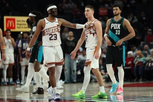 Feb 3, 2026; Portland, Oregon, USA; Phoenix Suns guard Jordan Goodwin (23) recognizes teammate guard Collin Gillespie (12) during the second half against the Portland Trail Blazers at Moda Center. Mandatory Credit: Jaime Valdez-Imagn Images