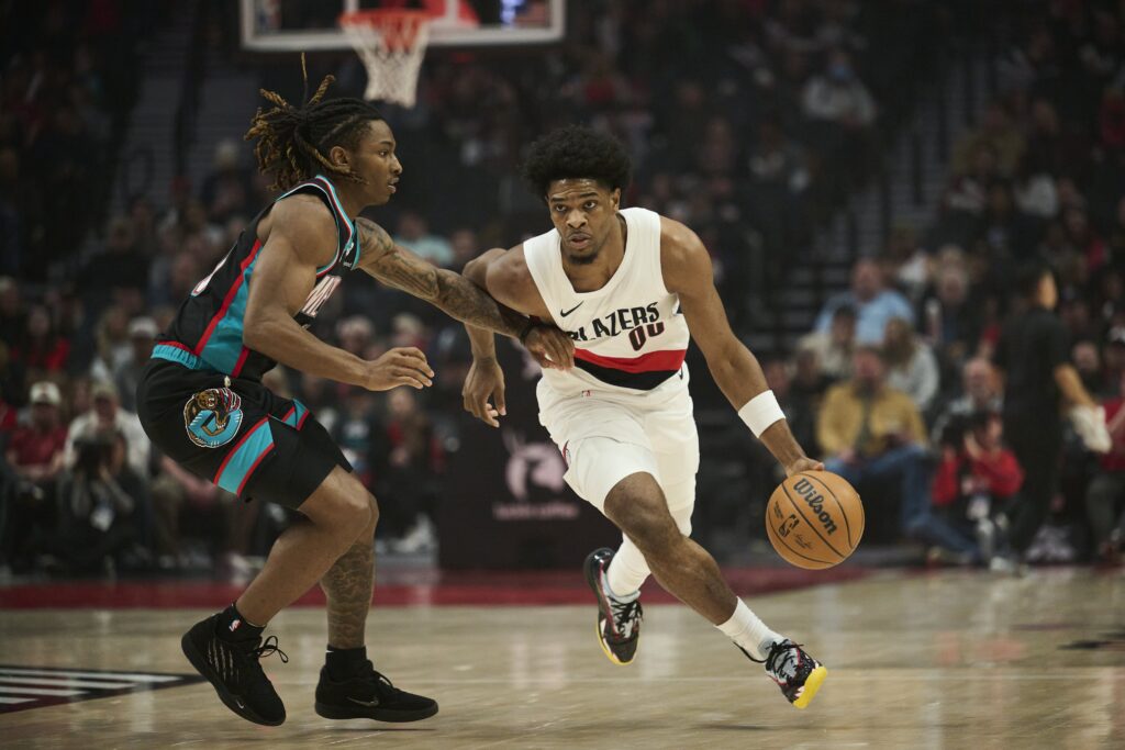 Feb 6, 2026; Portland, Oregon, USA; Portland Trail Blazers guard Scoot Henderson (00) drives to the basket during the first half against Memphis Grizzlies guard Javon Small (10) at Moda Center. Mandatory Credit: Troy Wayrynen-Imagn Images