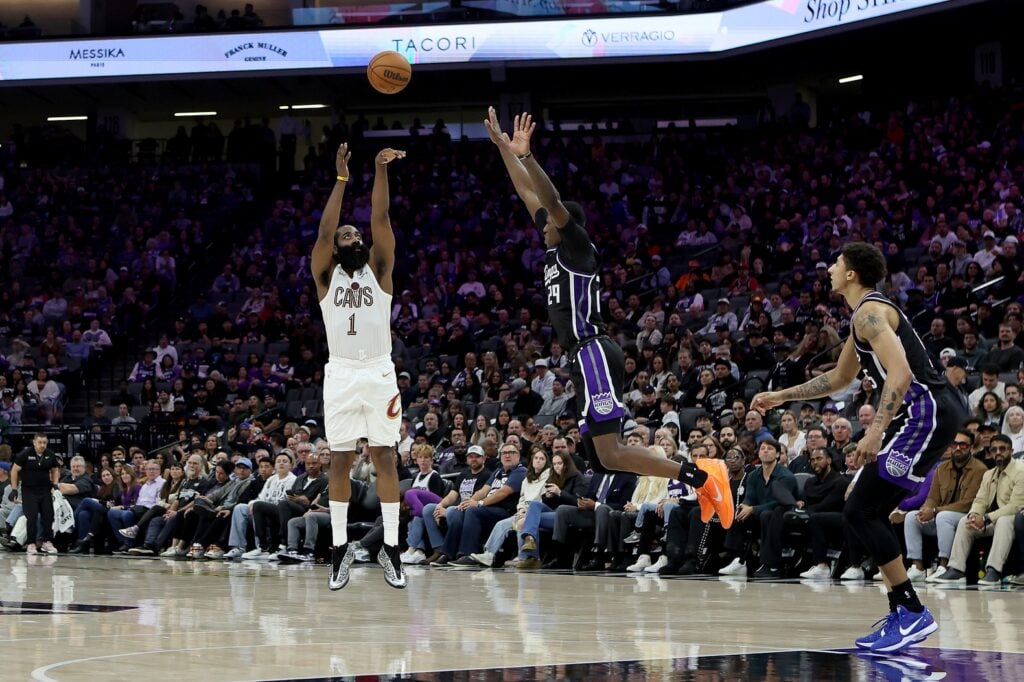 Feb 7, 2026; Sacramento, California, USA; Cleveland Cavaliers guard James Harden (1) shoots over Sacramento Kings guard-forward Daeqwon Plowden (29) during the fourth quarter at Golden 1 Center. Mandatory Credit: Dennis Lee-Imagn Images