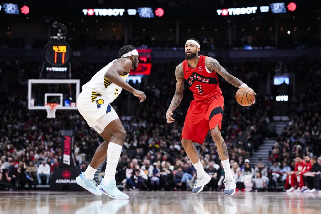 Feb 8, 2026; Toronto, Ontario, CAN; Toronto Raptors forward Brandon Ingram (3) dribbles against Indiana Pacers forward Jarace Walker (5) during the first half at Scotiabank Arena. Mandatory Credit: Kevin Sousa-Imagn Images