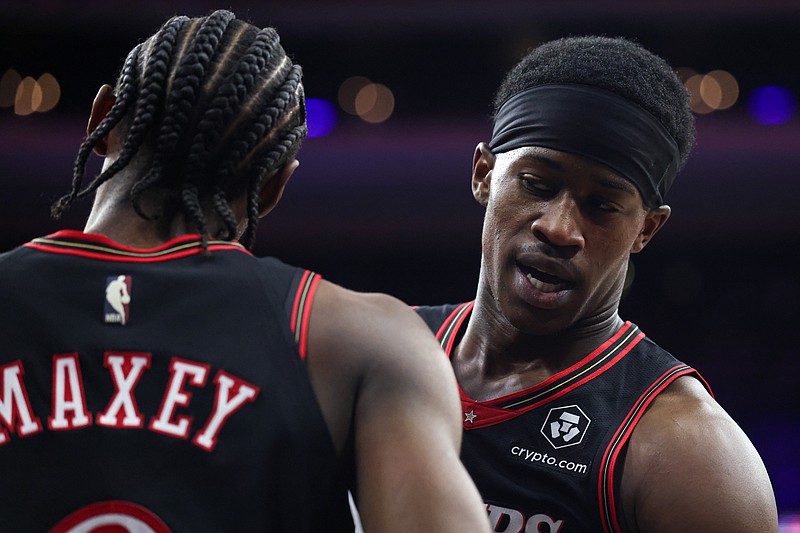 Feb 11, 2026; Philadelphia, Pennsylvania, USA; Philadelphia 76ers guard Vj Edgecombe (77) talks with guard Tyrese Maxey (0) after a play against the New York Knicks during the second half at Xfinity Mobile Arena. Mandatory Credit: Bill Streicher-Imagn Images