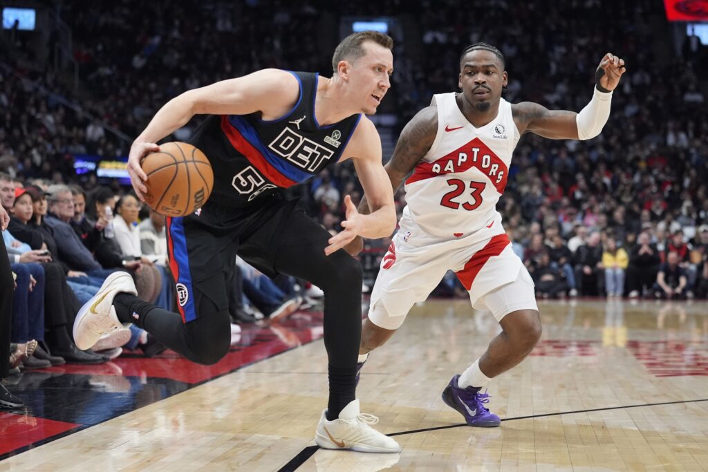 Feb 11, 2026; Toronto, Ontario, CAN; Detroit Pistons guard Duncan Robinson (55) drives to the net against Toronto Raptors guard Jamal Shead (23) during the first half at Scotiabank Arena. Mandatory Credit: John E. Sokolowski-Imagn Images