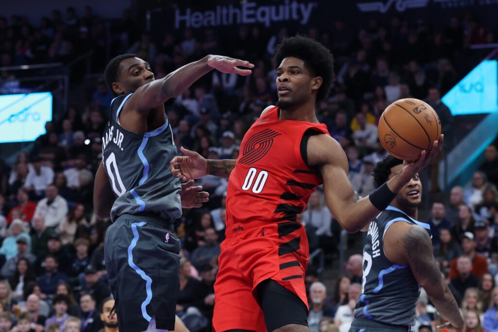 Feb 12, 2026; Salt Lake City, Utah, USA; Portland Trail Blazers guard Scoot Henderson (00) passes against Utah Jazz guard Vince Williams Jr. (0) during the first half at Delta Center. Mandatory Credit: Rob Gray-Imagn Images