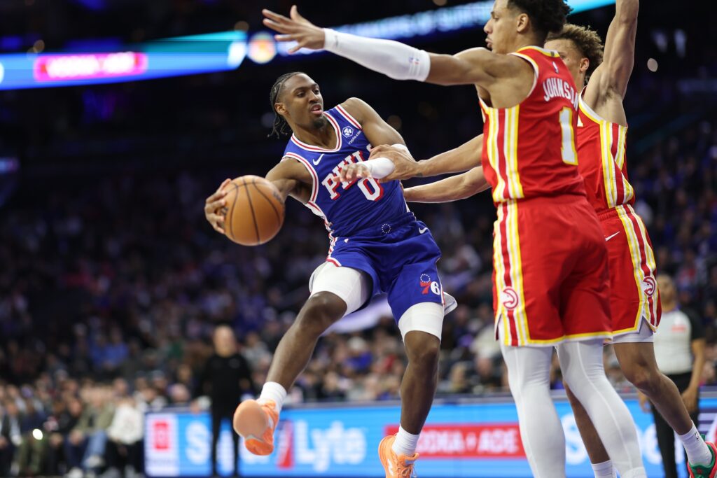 Feb 19, 2026; Philadelphia, Pennsylvania, USA; Philadelphia 76ers guard Tyrese Maxey (0) passes the ball against the Atlanta Hawks during the fourth quarter at Xfinity Mobile Arena.