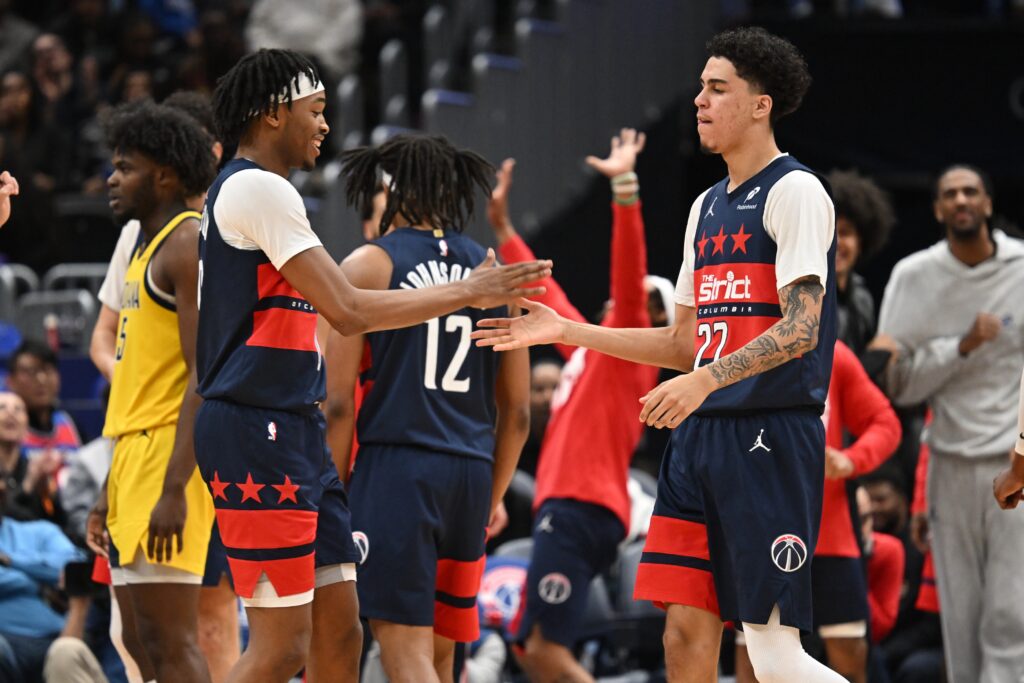 Washington Wizards guard Will Riley (27) celebrates a dunk with guard Bilal Coulibaly (0) against the Indiana Pacers during the third quarter at Capital One Arena.