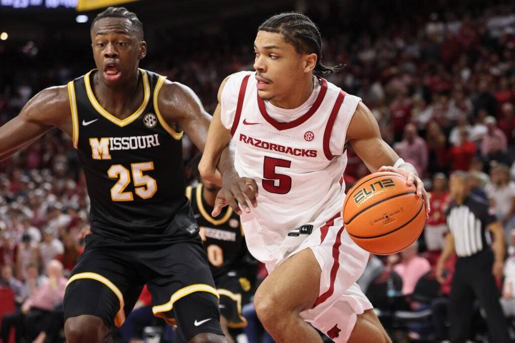  Arkansas Razorbacks guard Darius Acuff Jr (5) drives against Missouri Tigers guard Mark Mitchell (25) during the second half at Bud Walton Arena. Arkansas won 94-86.