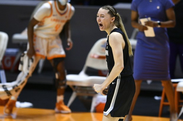 Connecticut's Paige Bueckers yells out in celebration after hitting a 3-pointer against Tennessee in the final moments of an NCAA women's college basketball game in Knoxville, Tenn., Thursday, Jan. 21, 2021. Connecticut won 67-61. (Saul Young/Knoxville News Sentinel via AP, Pool)