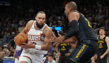 Phoenix Suns forward Dillon Brooks drives on Golden State Warriors center Al Horford (20) during th...