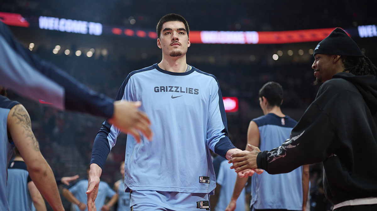 Memphis Grizzlies center Zach Edey (14) high fives teammates during introductions before a game against the Portland Trail Blazers at Moda Center.