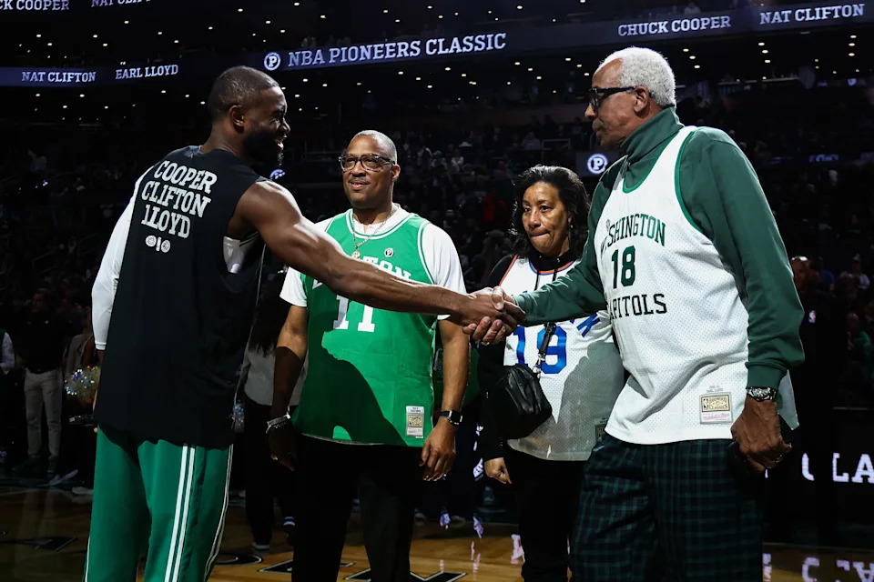 BOSTON, MA - FEBRUARY 1: Jaylen Brown #7 of the Boston Celtics greets Earl Lloyd, right, the first black player to play in an NBA game after being drafted by the Washington Capitals in 1950, as Chuck Cooper, center, the first black player to be drafted into the NBA by the Boston Celtics with their first pick in 1950, looks on before the inaugural NBA Pioneers Classic between the Boston Celtics and the Milwaukee Bucks honoring the 75th anniversary of the NBA's first black players at TD Garden on February 1, 2026 in Boston, Massachusetts. NOTE TO USER: User expressly acknowledges and agrees that, by downloading and/or using this Photograph, user is consenting to the terms and conditions of the Getty Images License Agreement. (Photo By Winslow Townson/Getty Images)
