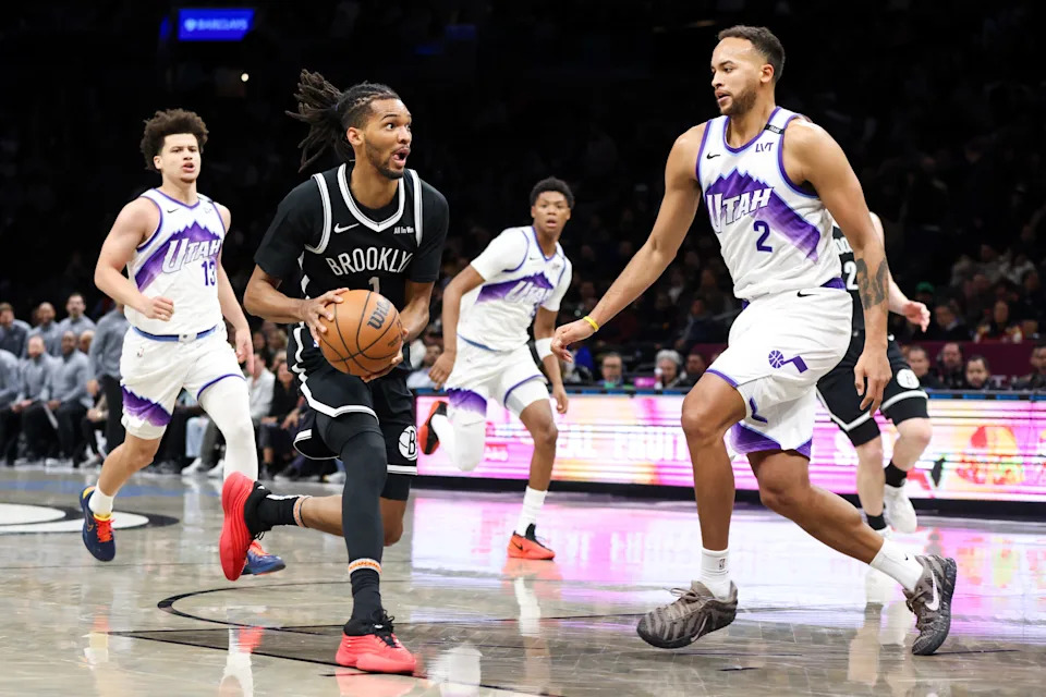 Dec 4, 2025; Brooklyn, New York, USA; Brooklyn Nets forward Ziaire Williams (1) drives to the net against Utah Jazz forward Kyle Anderson (2) during the second quarter at Barclays Center. Mandatory Credit: Tom Horak-Imagn Images