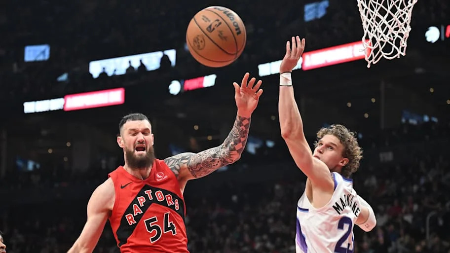 Toronto Raptors forward Sandro Mamukelashvili is fouled by Utah Jazz forward Lauri Markkanen