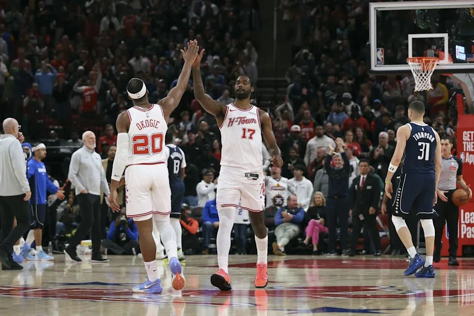 Jan 31, 2026; Houston, Texas, USA; Houston Rockets forward Tari Eason (17) celebrates with guard Josh Okogie (20) after a play during the fourth quarter against the Dallas Mavericks at Toyota Center. Mandatory Credit: Troy Taormina-Imagn Images