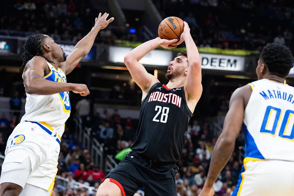 Feb 2, 2026; Indianapolis, Indiana, USA; Houston Rockets center Alperen Sengun (28) shoots the ball while Indiana Pacers guard/forward Aaron Nesmith (23) defends in the first half at Gainbridge Fieldhouse. Mandatory Credit: Trevor Ruszkowski-Imagn Images